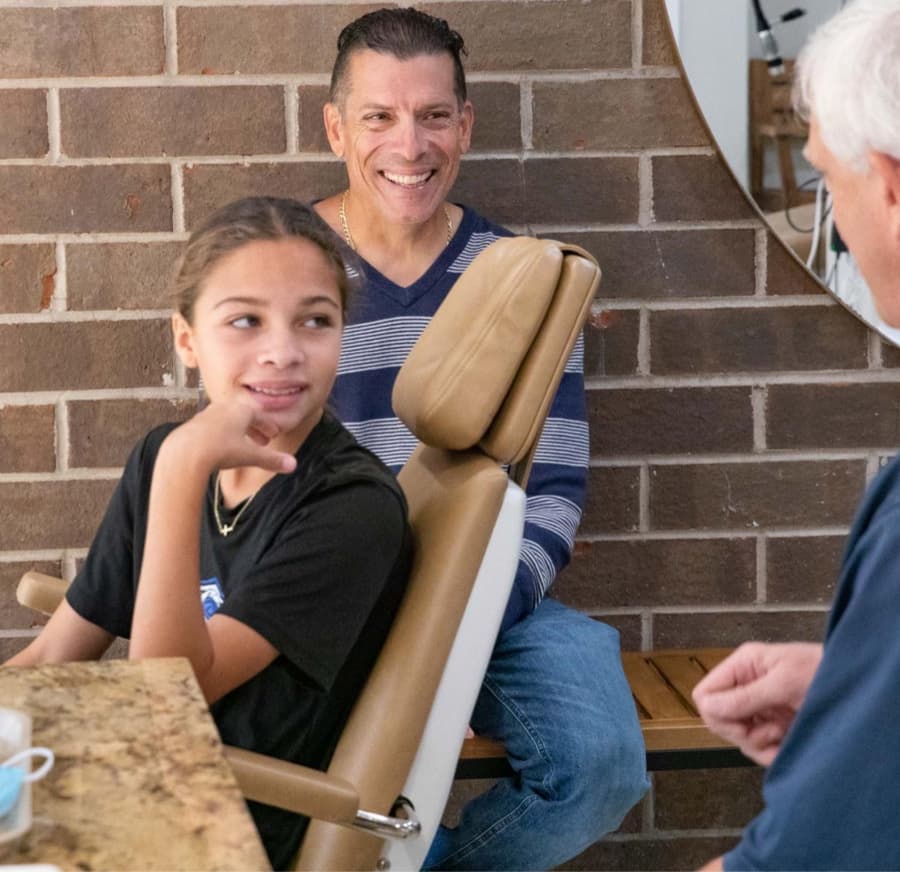 family smiling during free orthodontic consultation