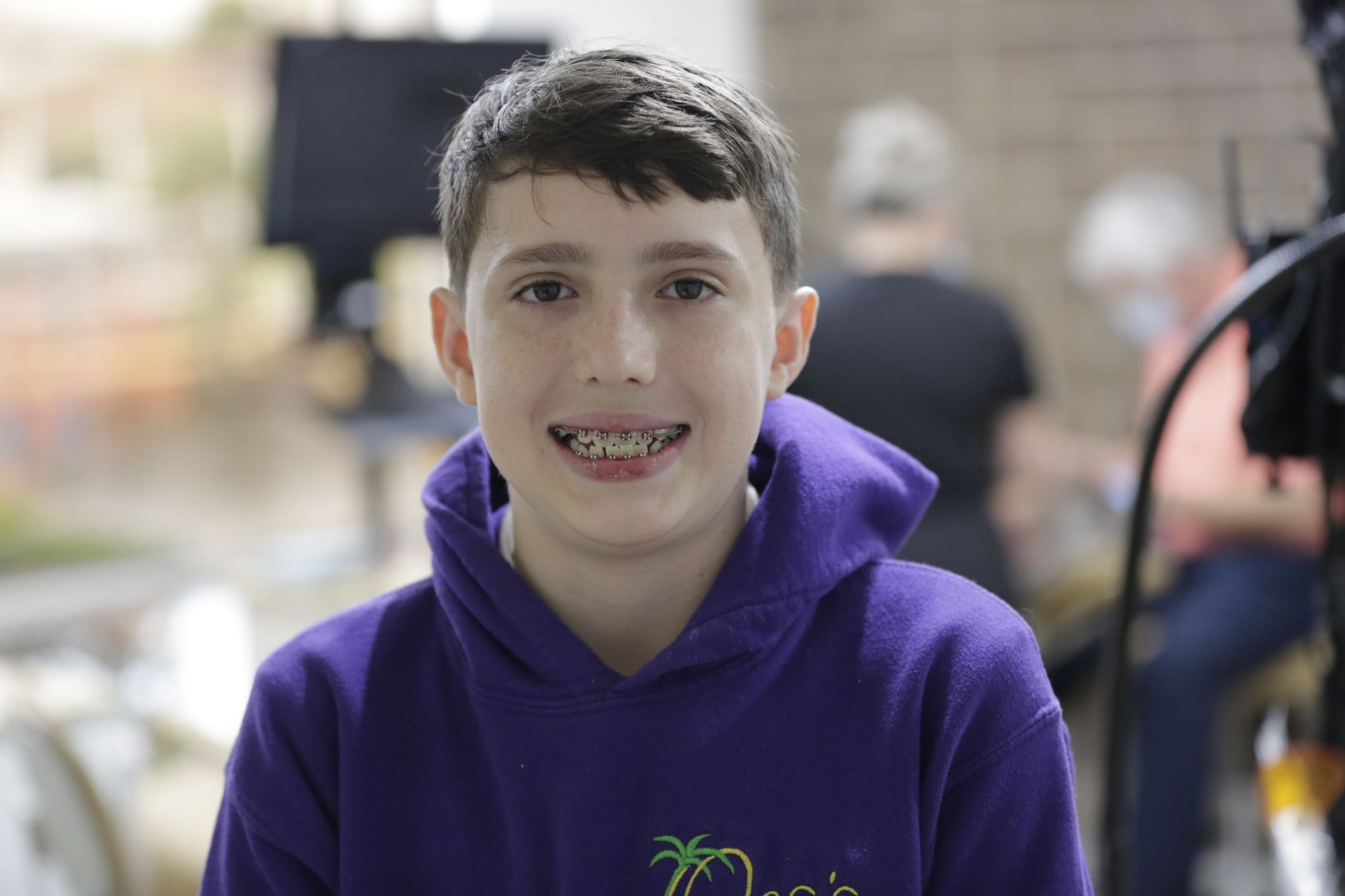 Boy smiling with braces &mdash; orthodontic care for kids in Cape Coral at Norton Orthodontics