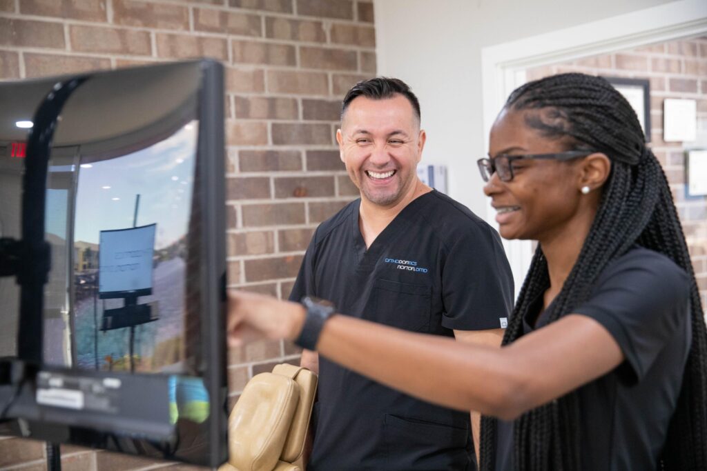 Dr. Norton and team during an Invisalign consultation at Norton Orthodontics Cape Coral